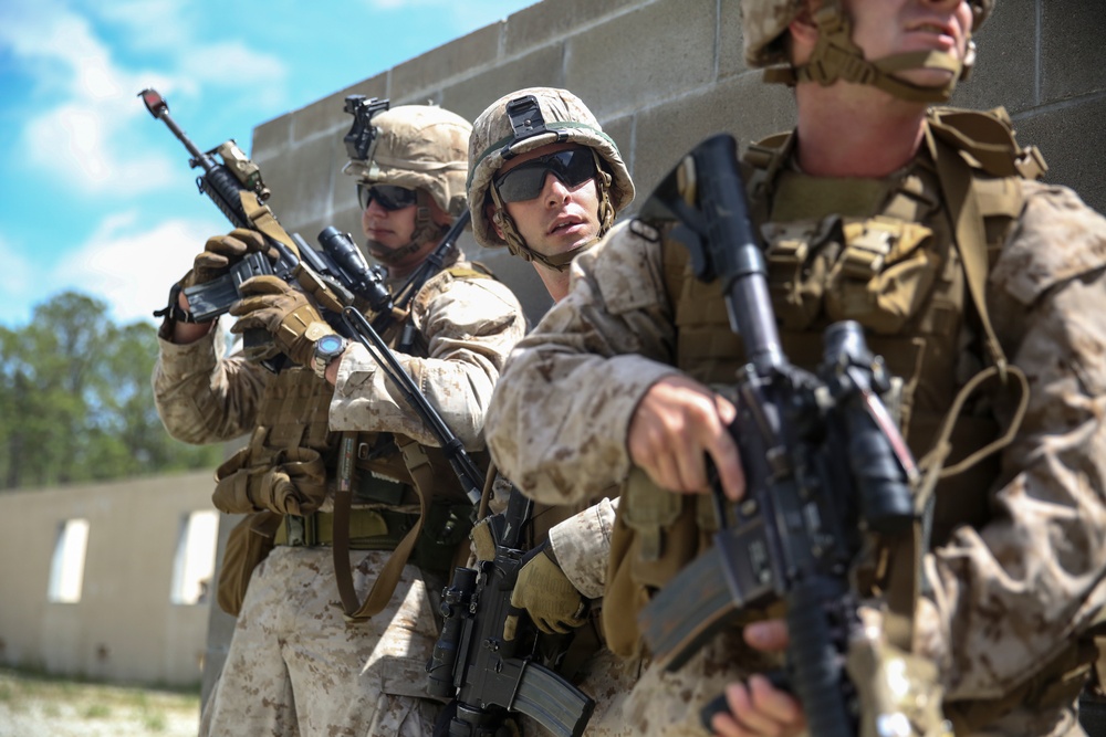 Marines attack from the sea, fight house to house