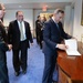 Secretary of Defense Ash Carter stands next to Haider al-Abadi Prime Minister of Iraq signing the guest book