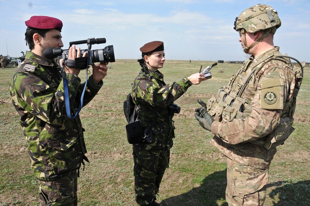 US Troopers, Romanian Land Forces and British soldiers participate in opening ceremonies for Exercise Wind Spring