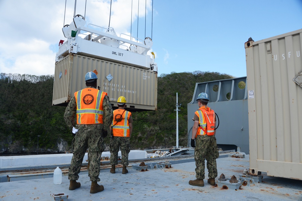 NCHB-1 Sailors onload munitions to MV Maj. Bernard F. Fisher