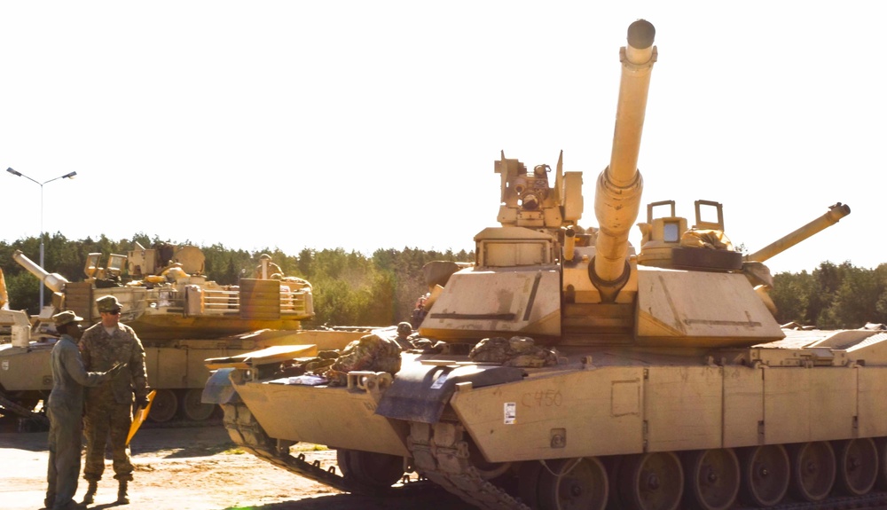 Soldiers assigned to 2nd Battalion, 7th Infantry Regiment, conduct vehicle maintenance at Camp Konotop, Poland.