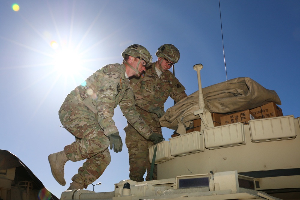 Soldiers of 2nd Battalion, 7th Infantry Regiment, conduct vehicle maintenance at Camp Konotop, Poland.