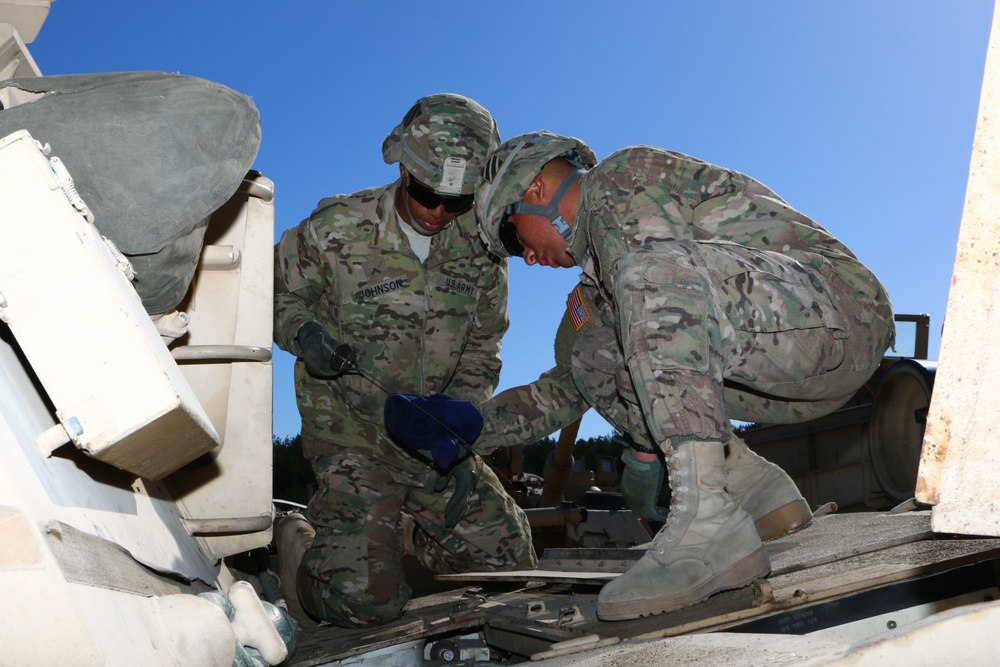 Soldiers of 2nd Battalion, 7th Infantry Regiment conduct vehicle maintenance at Camp Konotop, Poland.