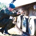 A Polish soldier conducts vehicle maintenance at Camp Konotop, Poland.