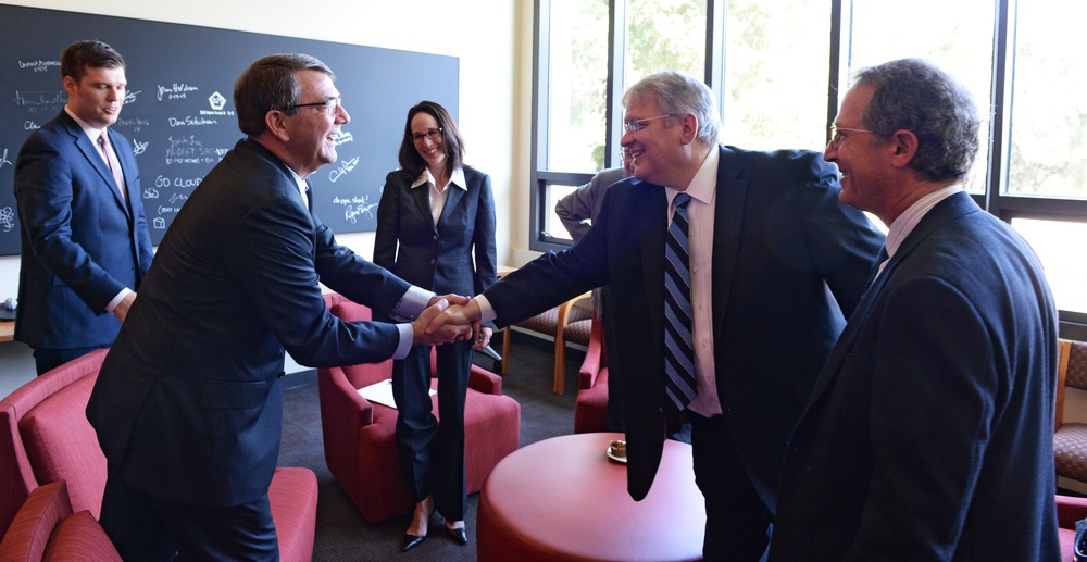 Secretary of Defense Ash Carter meets shakes hands with Dr. John Raisian at the Stanford University Cemex Auditorium