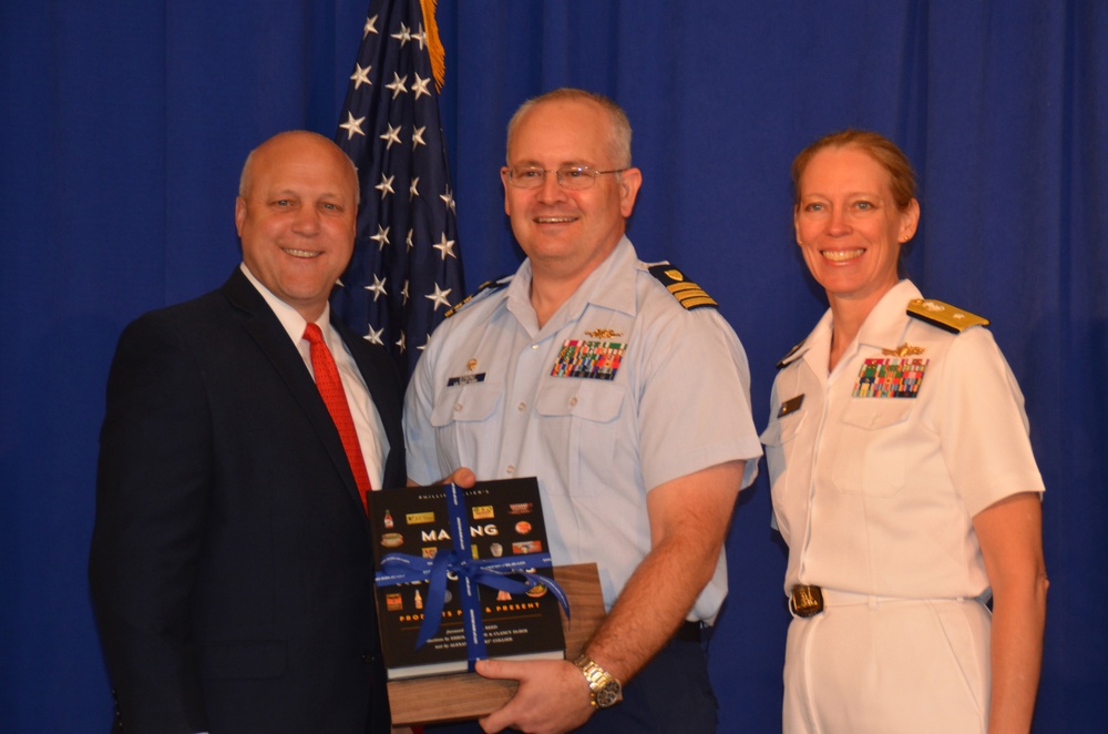 Cmdr. Christopher Strong receives gift from New Orleans Mayor Mitch Landrieu