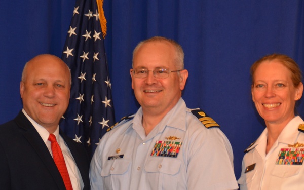 Cmdr. Christopher Strong receives gift from New Orleans Mayor Mitch Landrieu