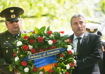 Representatives from the Embassy of Armenia carry a wreath to The Spirit of the Elbe in Arlington National Cemetery
