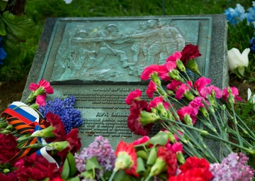 Flowers lay on the Spirit of the Elbe marker in Arlington National Cemetery