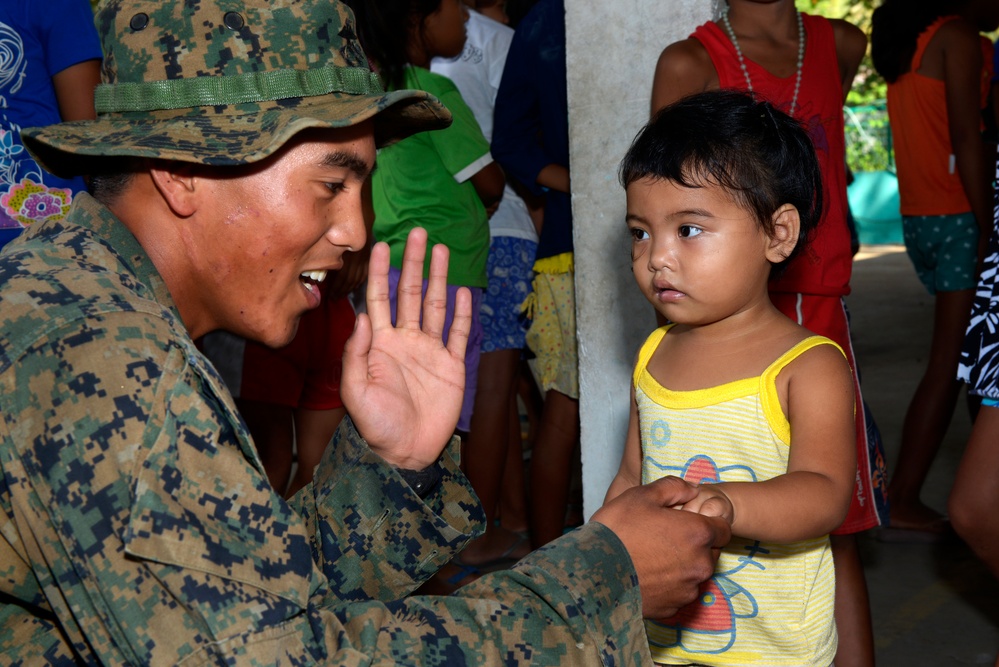 Service members visit Santa Juliana Elementary School during Balikatan 2015