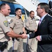 Secretary of Defense Ash Carter presents law enforcement officers with SECDEF coin