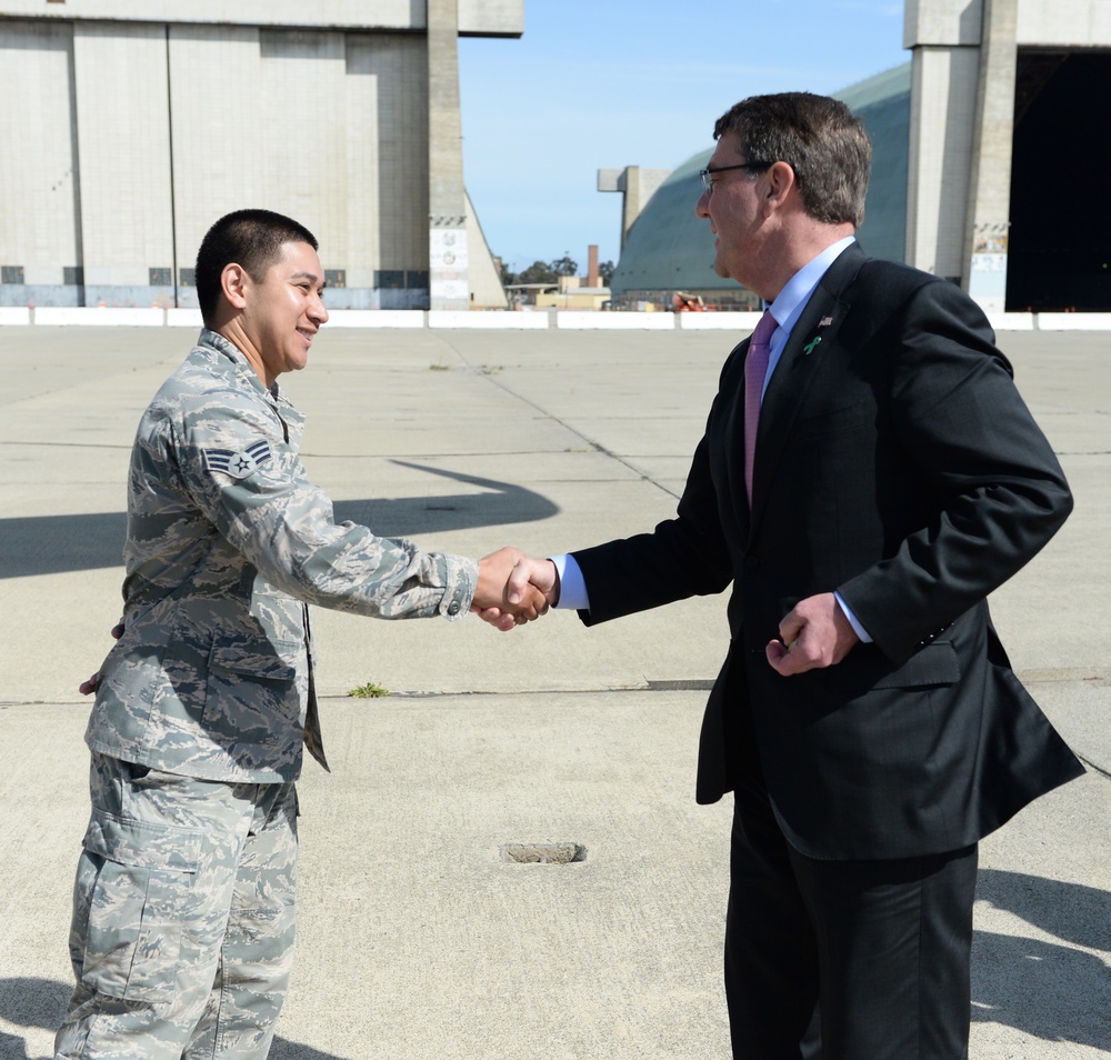 Secretary of Defense Ash Carter presents Airmen with SECDEF coin