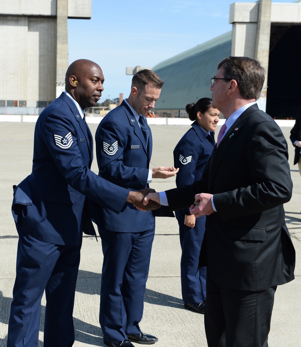 Secretary of Defense Ash Carter presents Airmen with the SECDEF coin for hosting his visit to Silicon Valley