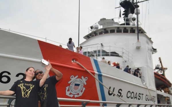 NOLA Navy Week - Couple poses for selfie in front of CGC Dauntless