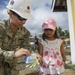 Service members connect with children in local community of Tapaz during Balikatan 2015