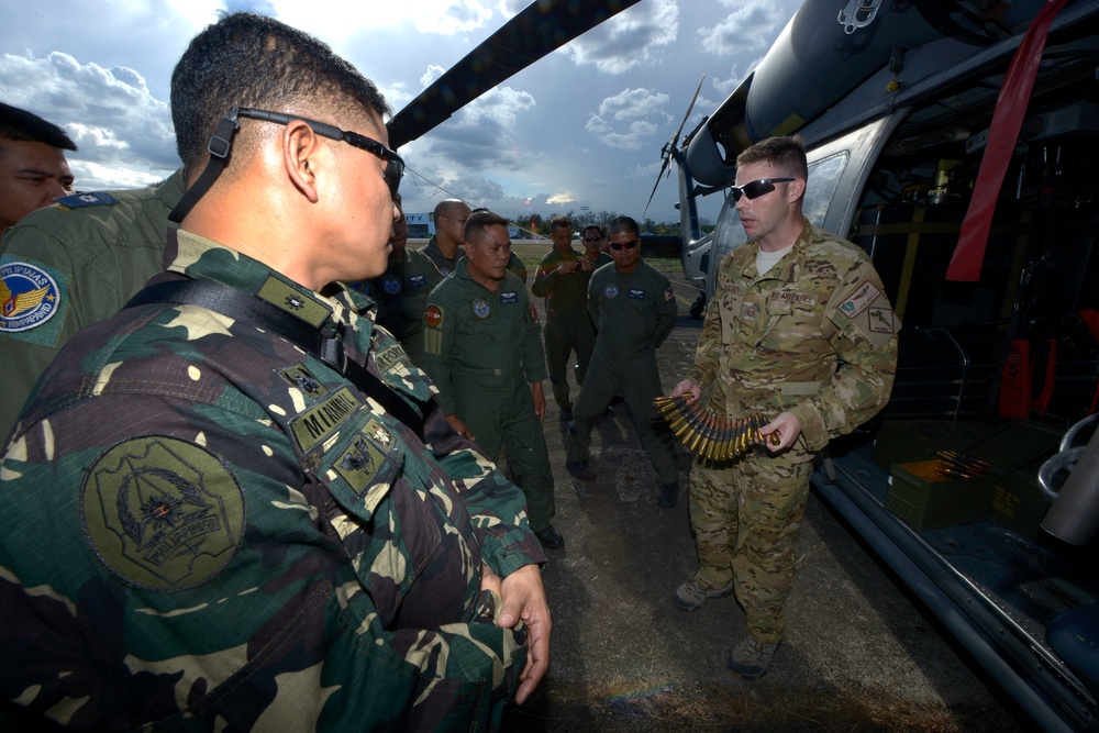 US and Philippine Forces exchange information about HH-60G Pave Hawk helicopters during Balikatan 2015