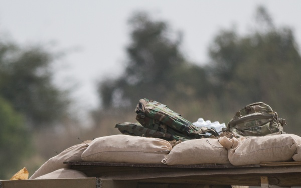 Iraqi soldier assaults bunker in exercise