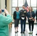 Members of The Old Guard pose for photographs in the Welcome Center of Arlington National Cemetery