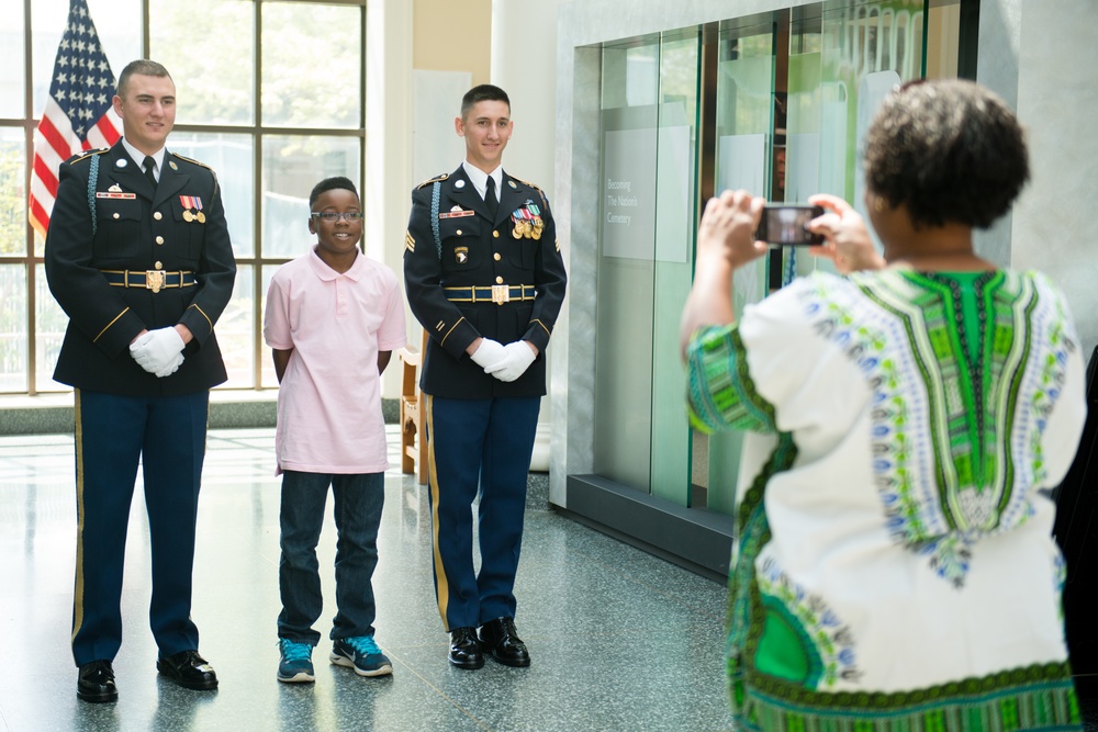 Members of The Old Guard pose for photographs in the Welcome Center of Arlington National Cemetery