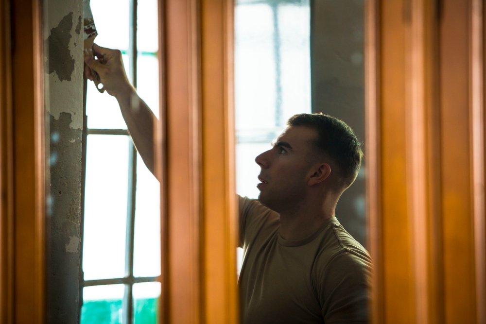A Caring Community: U.S. Marines volunteer at historic Spanish convent