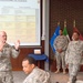 AG corps Chief Warrant Officer 5 Jones and Command Sgt. Maj. Shirley briefing in SHAPE