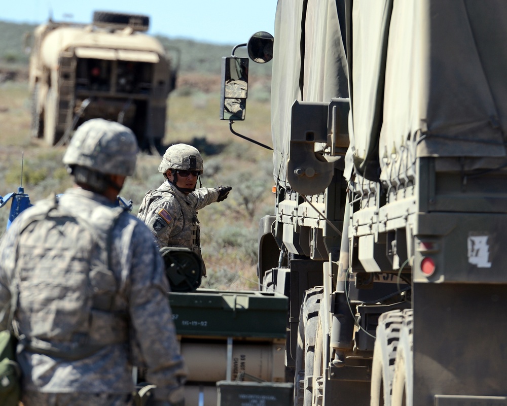Soldiers of 1-37 Field Artillery Regiment positioning an ammunition truck
