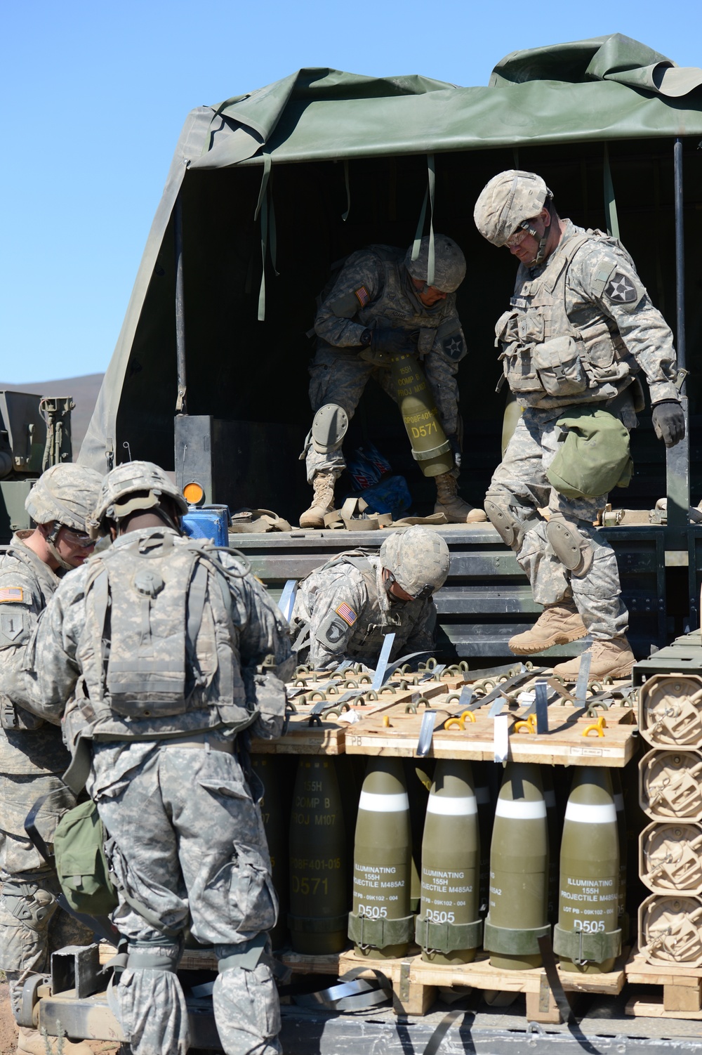 Soldiers of 1-37 Field Artillery loading an ammunition truck