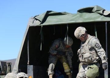 Soldiers of 1-37 Field Artillery loading an ammunition truck