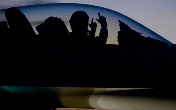 F-16 student pilot gives gunfighter salute