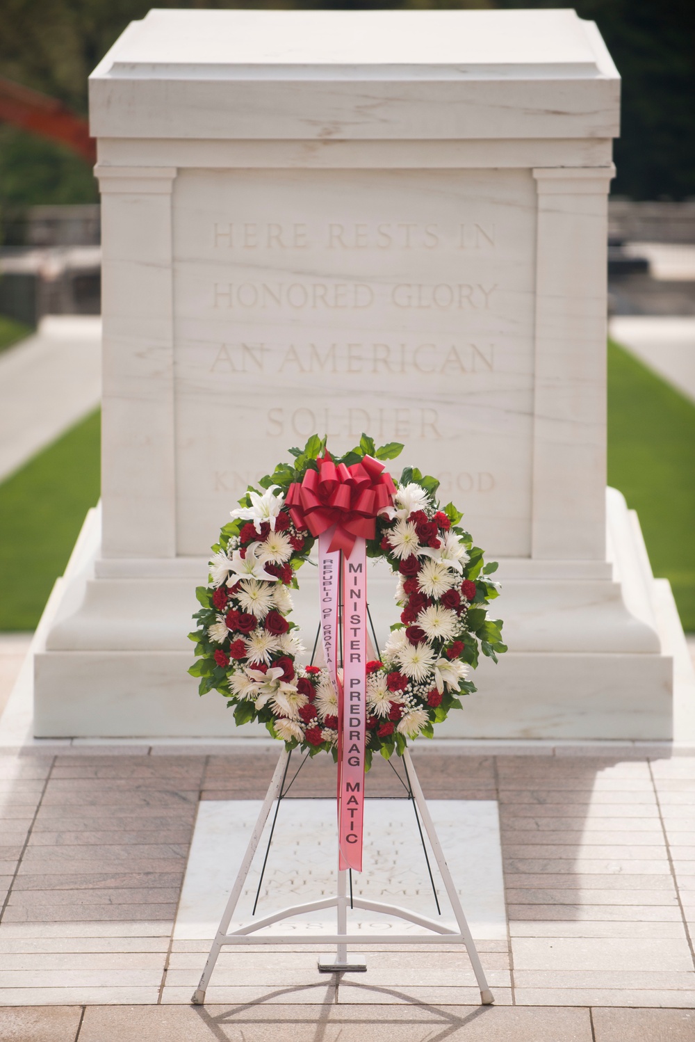 The wreath laid by Republic of Croatia minister of veterans affairs sits in front of the Tomb of the Unknown Soldier in Arlington National Cemetery