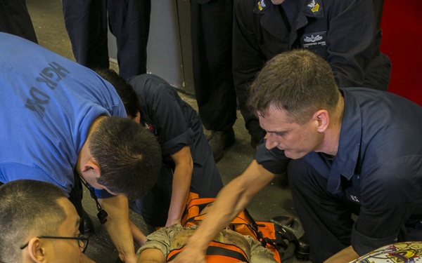 Sailors practice mass casualty evacuation aboard USS Wasp