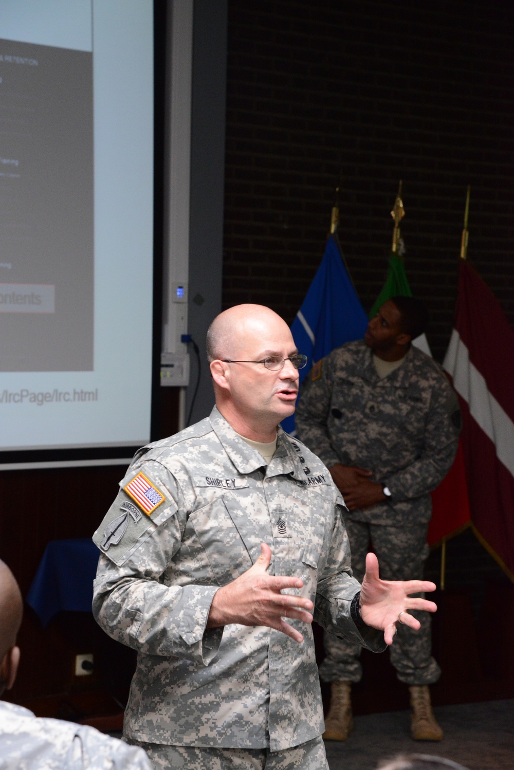 AG corps Chief Warrant Officer 5 Jones and Command Sgt. Maj. Shirley briefing in SHAPE