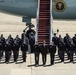 Obama departs JBA, stops to pose for group photo