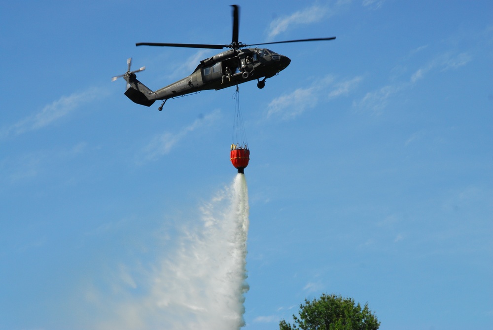 New York Army National Guard helicopter crews conduct fire bucket training at Round Lake on Tuesday