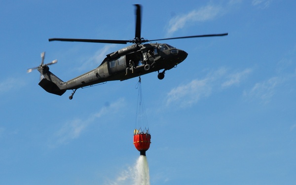New York Army National Guard helicopter crews conduct fire bucket training at Round Lake on Tuesday
