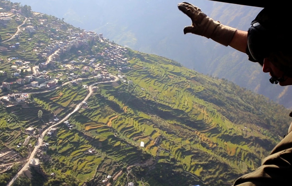 U.S. Marine aircraft survey Nepal earthquake damage, support USAID efforts