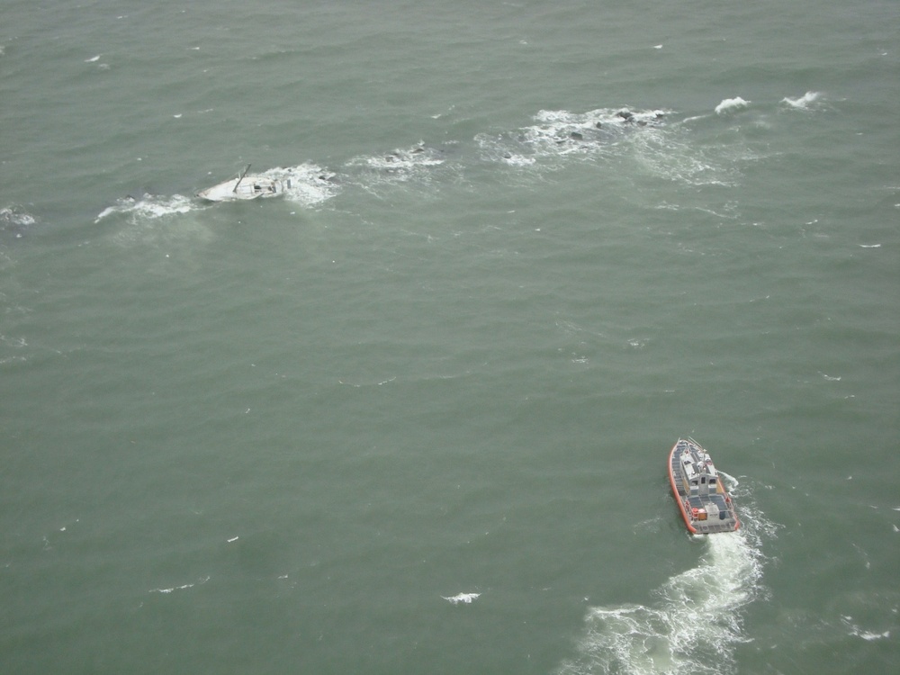 Coast Guard rescues 2 from storm-tossed sailboat