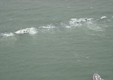 Coast Guard rescues 2 from storm-tossed sailboat