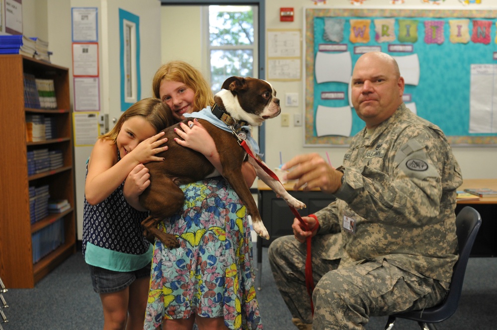 3rd Cav trooper volunteers with 'Buster the Tank Dog'