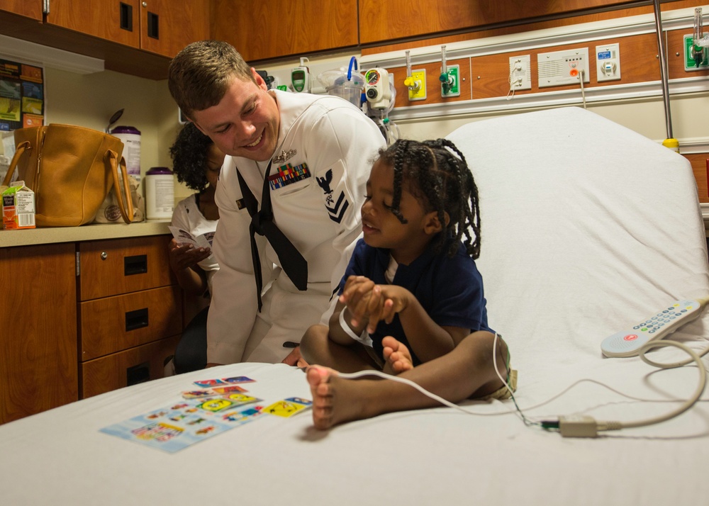 Sailors bring smiles to patients during COMREL