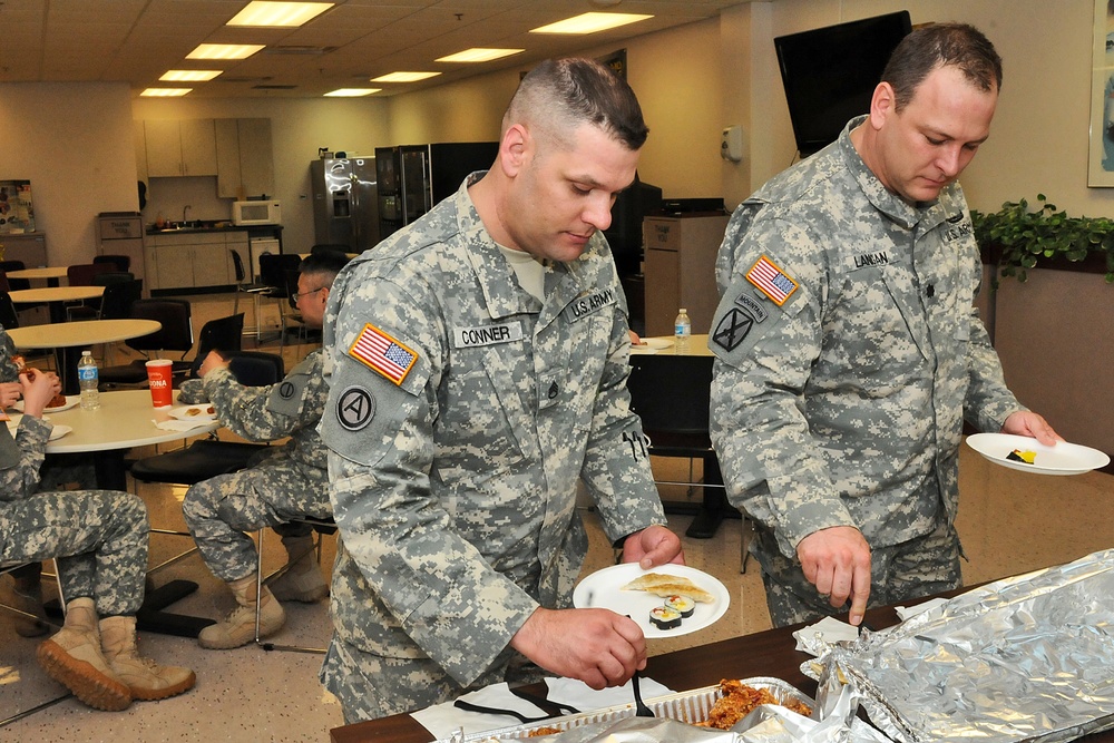 Army Reserve soldiers sample Asian dishes during a unit ethnic observance
