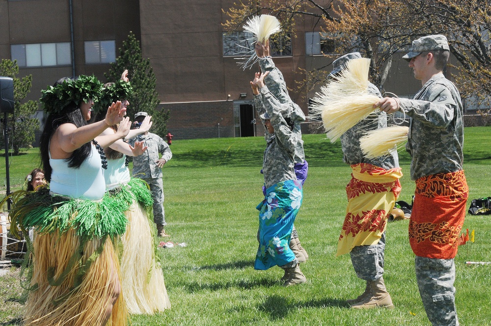 Army Reserve soldiers learn a Hawaiian dance during ethnic observance