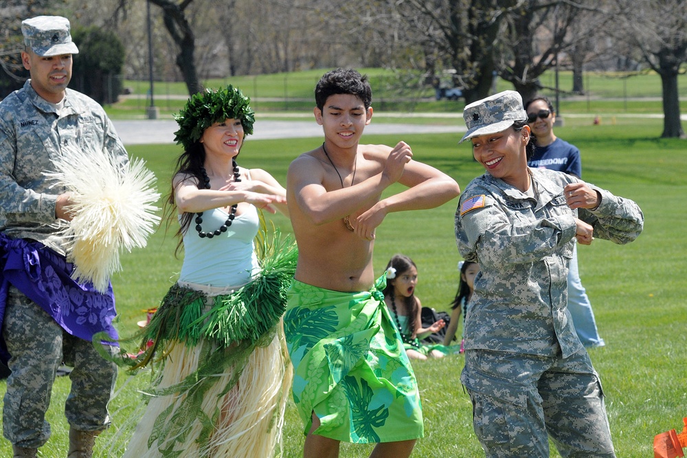 Army Reserve soldiers learn a Hawaiian dance during ethnic observance
