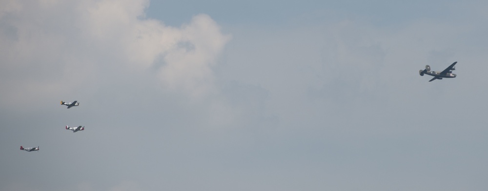 World War II era planes fly over Washington, DC, seen from Arlington National Cemetery