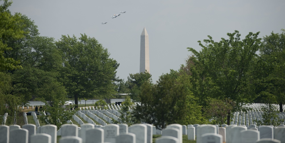 World War II era planes fly over Washington, D.C., seen from Arlington National Cemetery