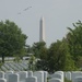 World War II era planes fly over Washington, D.C., seen from Arlington National Cemetery