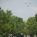 World War II era planes fly over Washington, D.C. seen from Arlington National Cemetery