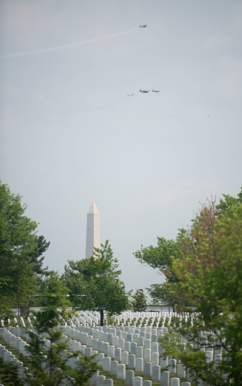 World War II era planes fly over Washington seen from Arlington National Cemetery