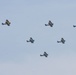 World War II era planes fly over Washington, DC, seen from Arlington National Cemetery