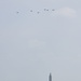 World War II era planes fly over Washington, DC seen from Arlington National Cemetery